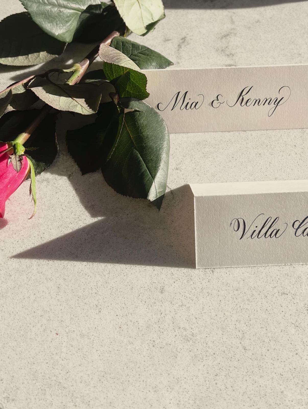 Calligraphy place cards with roses
