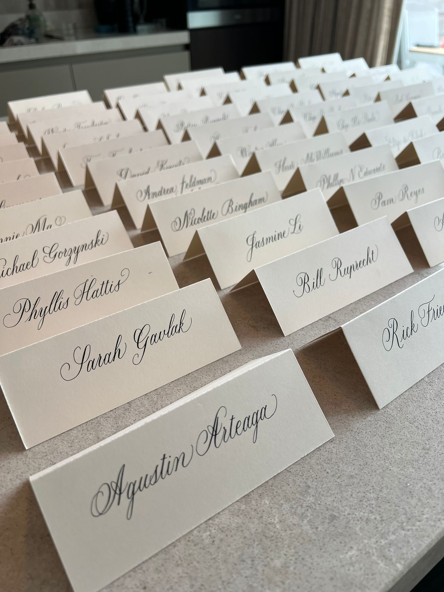 Live calligraphy place cards at an event